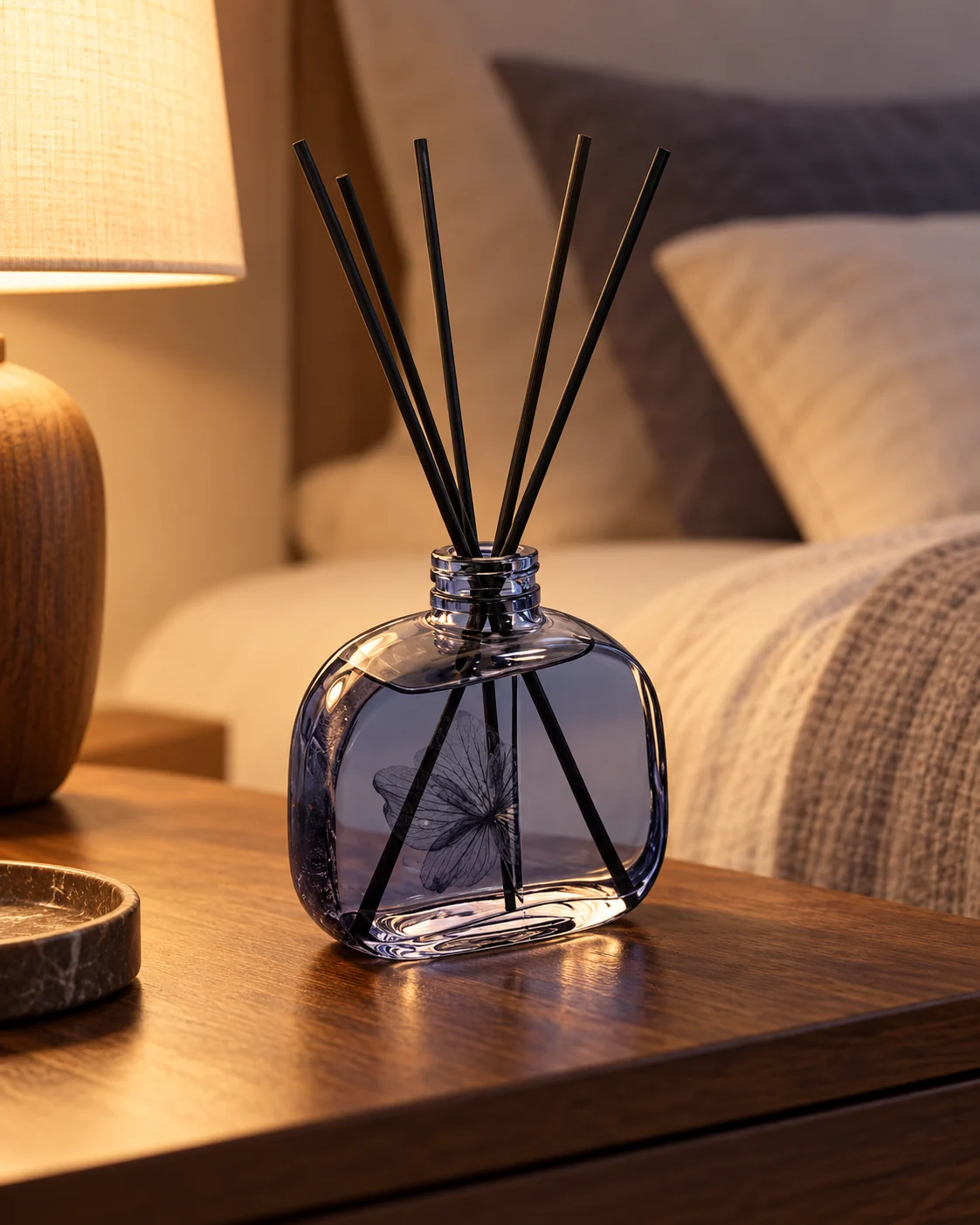 Round blue diffuser bottle in Bedroom bedside